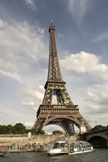 International Prints: The Eiffel Tower and a tourist boat on the River Seine viewed from near the Jardin du Trocadero