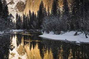 Snowy Prints: El Capitan above the Merced River in winter, Yosemite National Park, California USA