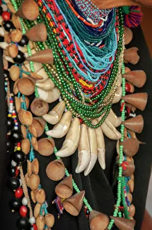 Teeth Prints: The elaborate regalia of a shaman in the Amazon jungle features jaguar teeth and beads