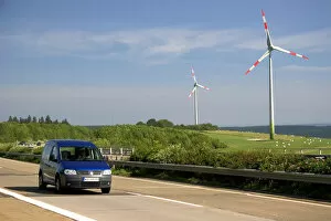 Electricity wind generators and automobiles traveling on the autobahn in northwest