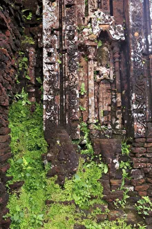 Images Dated 13th December 2017: Encroaching moss and Hindu statues at My Son Sanctuary, Quang Nam Province, Vietnam