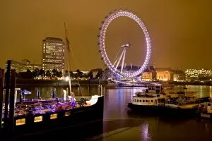 England, London. River Thames and the London Eye at Night