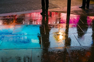 England, London, Soho, Piccadilly Circus, wet sidewalk reflections