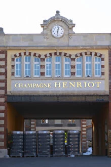 The entrance to the winery at Champagne Henriot with empty champagne bottles, Reims