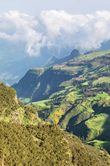 Prints of Ethiopia. Amhara. North Gondar. View of farms and a village in the Ethiopian highlands Images Dated 2024 April: Ethiopia. Amhara. North Gondar. View of farms and a village in the Ethiopian highlands