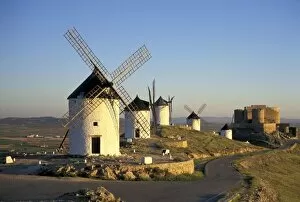 Images Dated 28th July 2004: EU, Spain, La Mancha, Consuegra. Windmills and castle in the background