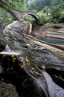 Mountainside Prints: EU, Switzerland, Ticino Region, Val Verzasca, River rock intrusions and bridge