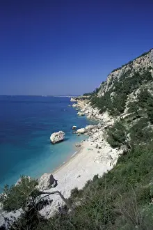 White Sand Prints: Europe, Albania. Coastal Road, sandy beach and crystal clear waters of the Mediterranean