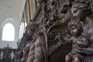 Flanders Prints: Europe, Belgium, Antwerp. Sculptures depicting saints and angels are carved into