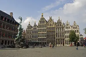 Grote Market Prints: Europe, Belgium, Antwerp. A woman photographs a small child in the center of Antwerp s