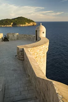Images Dated 7th October 2006: Europe, Croatia, Dalmatia, Dubrovnik. Old city walls (built 10th century) above Adriatic Sea