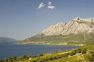 Europe, Croatia, Dalmatia, Lush fields and town of Orebic on the Peljesac peninsula