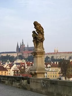 Images Dated 17th September 2006: Europe, Czech Republic, Prague. A statue of St. Anne, with Prague Castle in the background