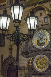 Europe, Czech Republic, Prague. Street lamp and Astronomical Clock at night. Credit as