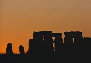 Pre Historic Prints: Europe, England, Stonehenge. Sunset light silhouettes the pillars at Stonehenge