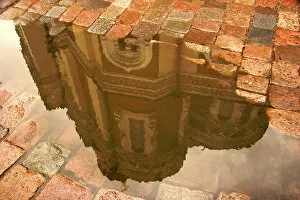 Europe, Estonia, Tallinn. Reflection of Alexander Nevsky Cathedral in puddle of rain water