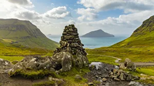 Pillar Prints: Europe, Faroe Islands. View of stone pillar overlooking the bay on the road to