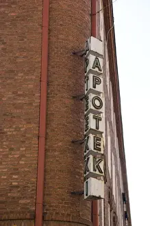 Medicine Prints: Europe, Finland, Helsinki. A sign alongside building for a Finnish pharmacy. Credit as