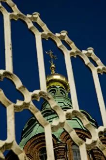 Europe, Finland, Helsinki. Spire of Uspenski Cathedral seen through metal gate. Credit as
