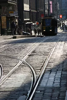 Europe, Finland, Helsinki, Tramway tracks with a tram in city center