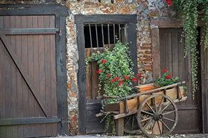 Images Dated 7th September 2012: Europe; France; Alsace province; Colmar. Rustic wooden wagon in front of brick building