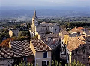 Europe, France, Bonnieux. Sunset light falls on the tile roofs of Bonnieux, Provence, France