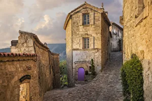 Lacoste Prints: Europe, France, Lacoste. Street scene at sunrise