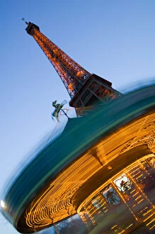 Europe, France, Paris, Eiffel Tower Area: Evening View of the Eiffel Tower & Carousel
