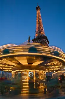 Images Dated 12th March 2005: Europe, France, Paris, Eiffel Tower Area: Evening View of the Eiffel Tower & Carousel