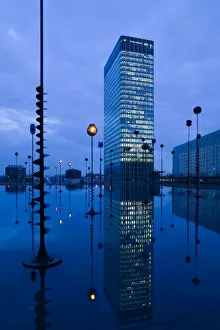 Europe, France, Paris, La Defense: Bassin Takis (Pool) with Nobel Building / Evening