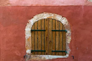 Images Dated 8th July 2014: Europe, France, Provence, Roussillon. Wooden shutters in red wall
