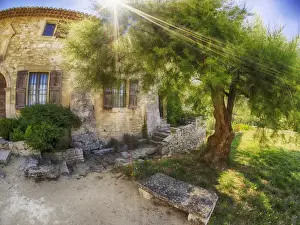 Wide Angle Prints: Europe; France; Provence; Sunrays streaming above St Hilaire Abbey