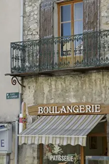 Sault Prints: Europe, France, Sault. A bakery sits beneath an apartment. Credit as: Josh Anon /