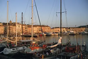 Europe, France, St. Tropez Ships in port and city skyline