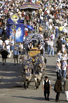 Fair Prints: Europe, Germany, Munich. Oktoberfest, horse drawn beer wagon makes its way through crowd