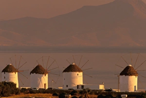 Images Dated 10th May 2011: Europe, Greece, Cyclades Islands, Mykonos. Sunrise with Mykonos windmills