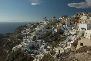 Aegean Prints: Europe, Greece, Cyclades, Santorini: the villge of Oia perches atop a clifftop overlooking