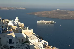 Images Dated 28th June 2005: Europe, Greece, Dodecanese, Santorini: dawn breaking over anchored cruise ship