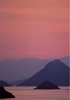 Region Prints: Europe, Greece, Island of Hydra. Small islands neighboring the Peloponnese at sunset