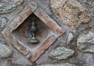 Greek Orthodox Prints: Europe, Greece, Meteora. Oil lamp embedded in stone wall at Grand Meteora Monastery