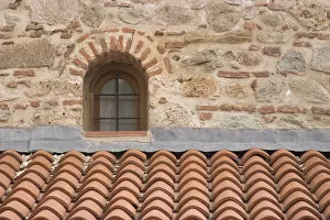 Europe, Greece, Meteora. Tile roof and small window in Grand Meteora Monastery. Credit as