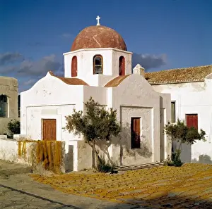 White Washed Prints: Europe, Greece, Mykonos. Fishing nets dry on the chapel wall on the island of Mykonos