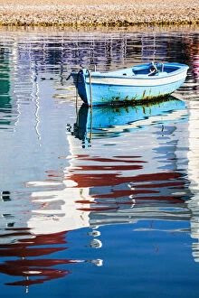 Europe, Greece, Mykonos, Hora, Fishing Boat and Reflection of a Church in the Water
