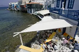 Hora Prints: Europe, Greece, Mykonos, Hora. People socialize in cafes in Little Venice portion of city