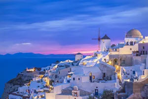 Images Dated 2nd June 2014: Europe, Greece, Oia. Greek Orthodox church and village at sunset