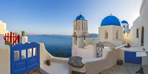 Images Dated 7th June 2014: Europe, Greece, Oia. Sunrise on Greek Orthodox church and village