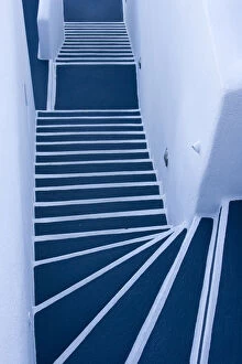 Europe, Greece, Santorini. Looking down on painted blue and white stairway. Credit as
