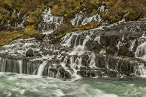 Icelandic Prints: Europe, Iceland, Hraunfossar. Waterfalls flow over igneous rocks into stream. Credit as