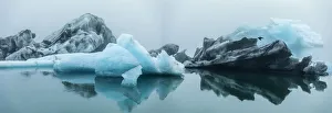 Icelandic Prints: Europe, Iceland. Morning fog softens the light shining on icebergs floating in