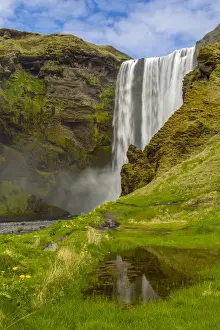 Europe, Iceland, Skogafoss. Waterfall reflects in pool